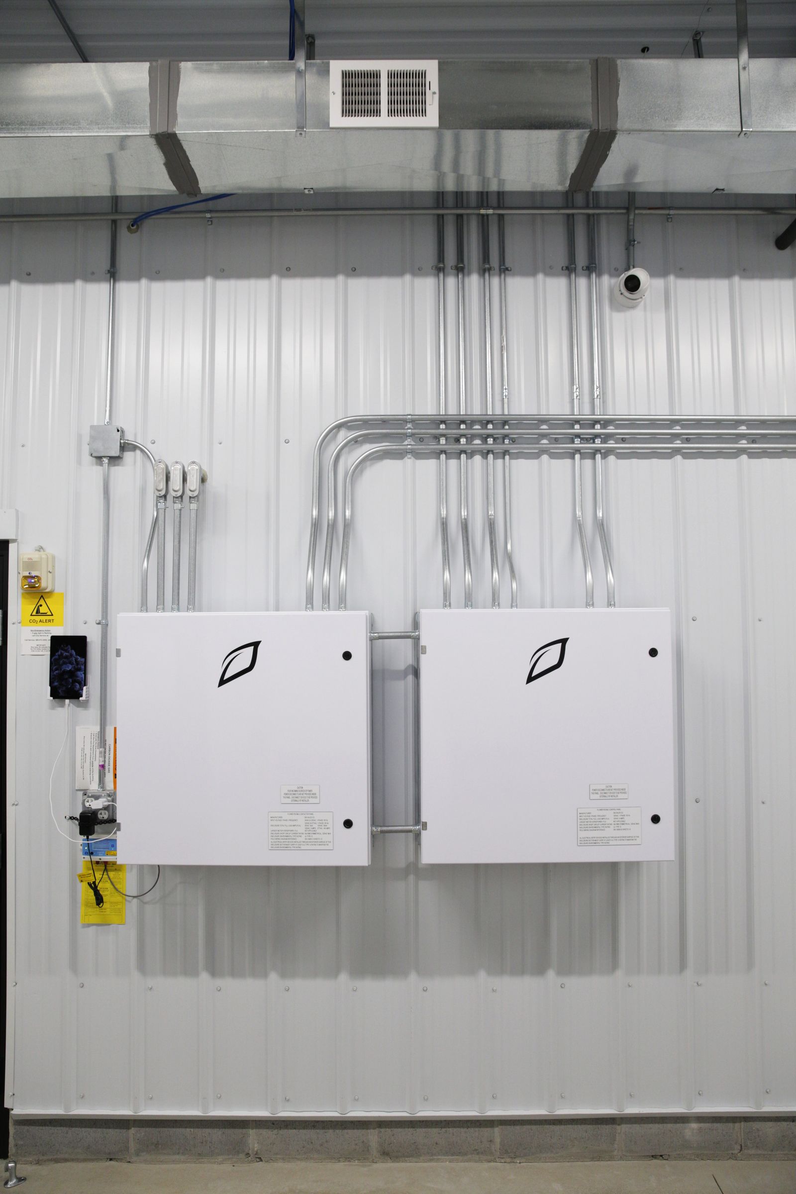 Multiple Growlink Core controllers installed on facility wall