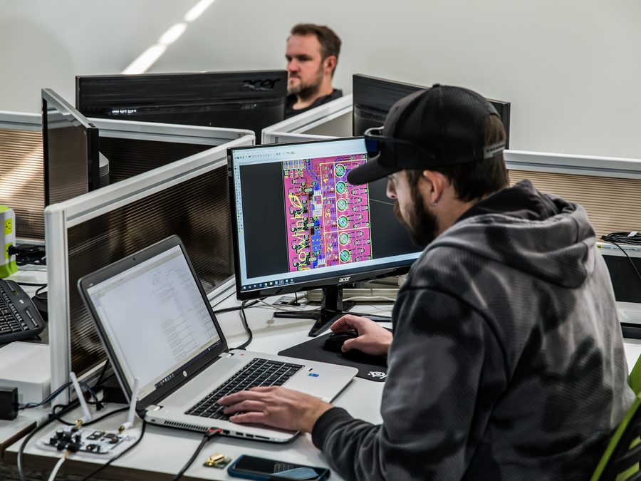 Growlink engineer designing PCB at workstation